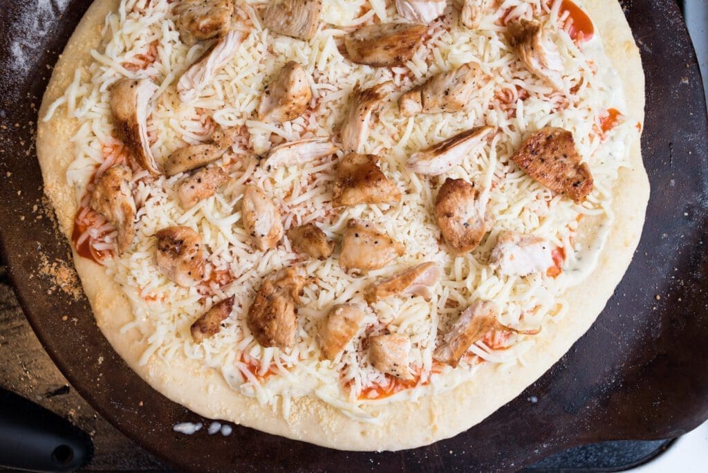place chicken on the pizza