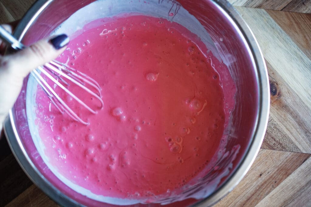 red food dye added to red velvet cupcakes