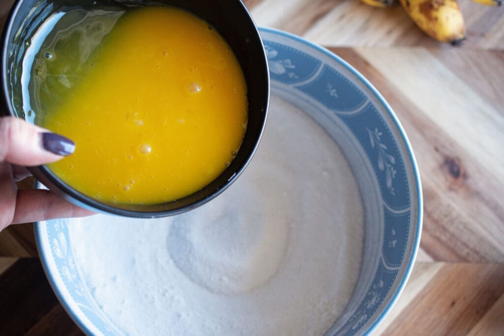 adding egg to cornstarch sugar