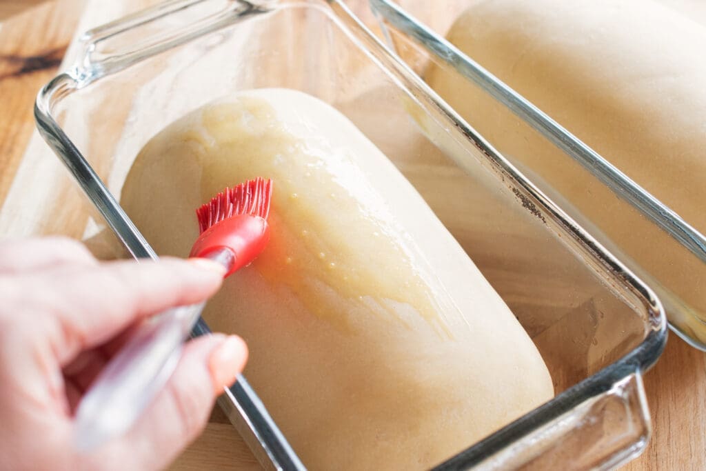 brushing loaves with egg wash